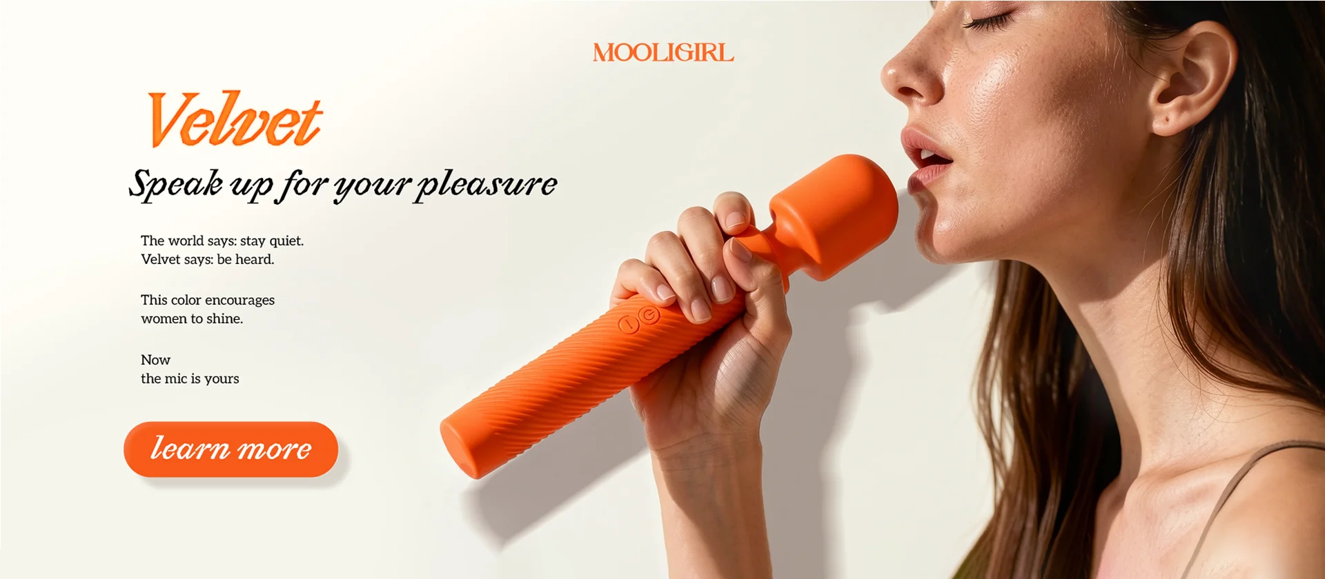 MOOLIGIRL Velvet product banner. A woman holds the orange Velvet wand as if speaking into a mic, with text "Speak up for your pleasure" and a "learn more" button.